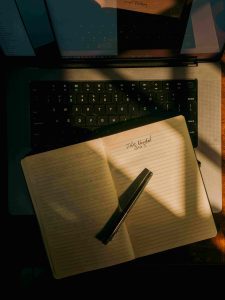 person writing down their master password in a notebook — the one password worth keeping on paper